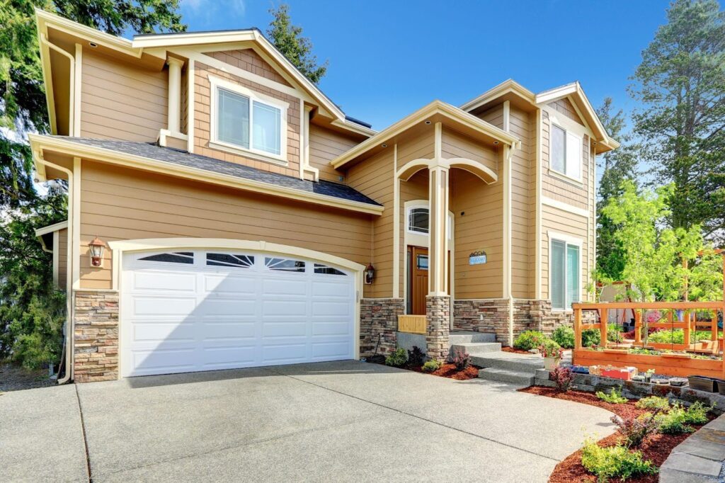 A beautiful home with a spacious garage and a well-maintained driveway